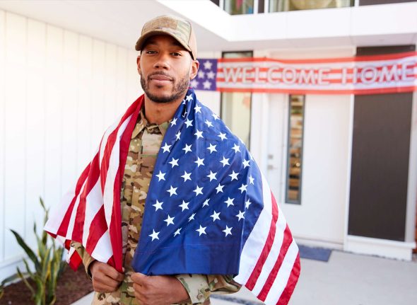millennial-black-soldier-with-us-flag-draped-over-2024-10-19-07-12-38-utc